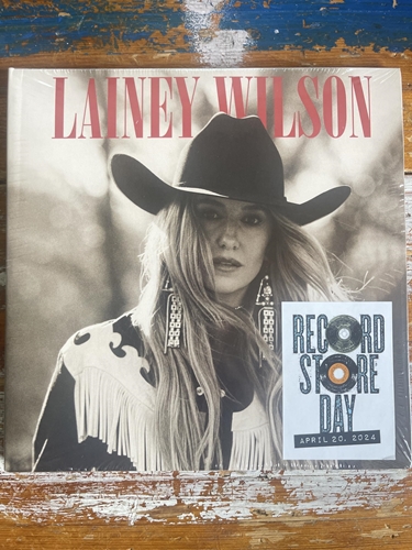 Picture of Ain’t that some shit, I found a few hits, cause country’s cool again (RSD24 EX)(7 Inch Vinyl)(2LP)  by Lainey Wilson